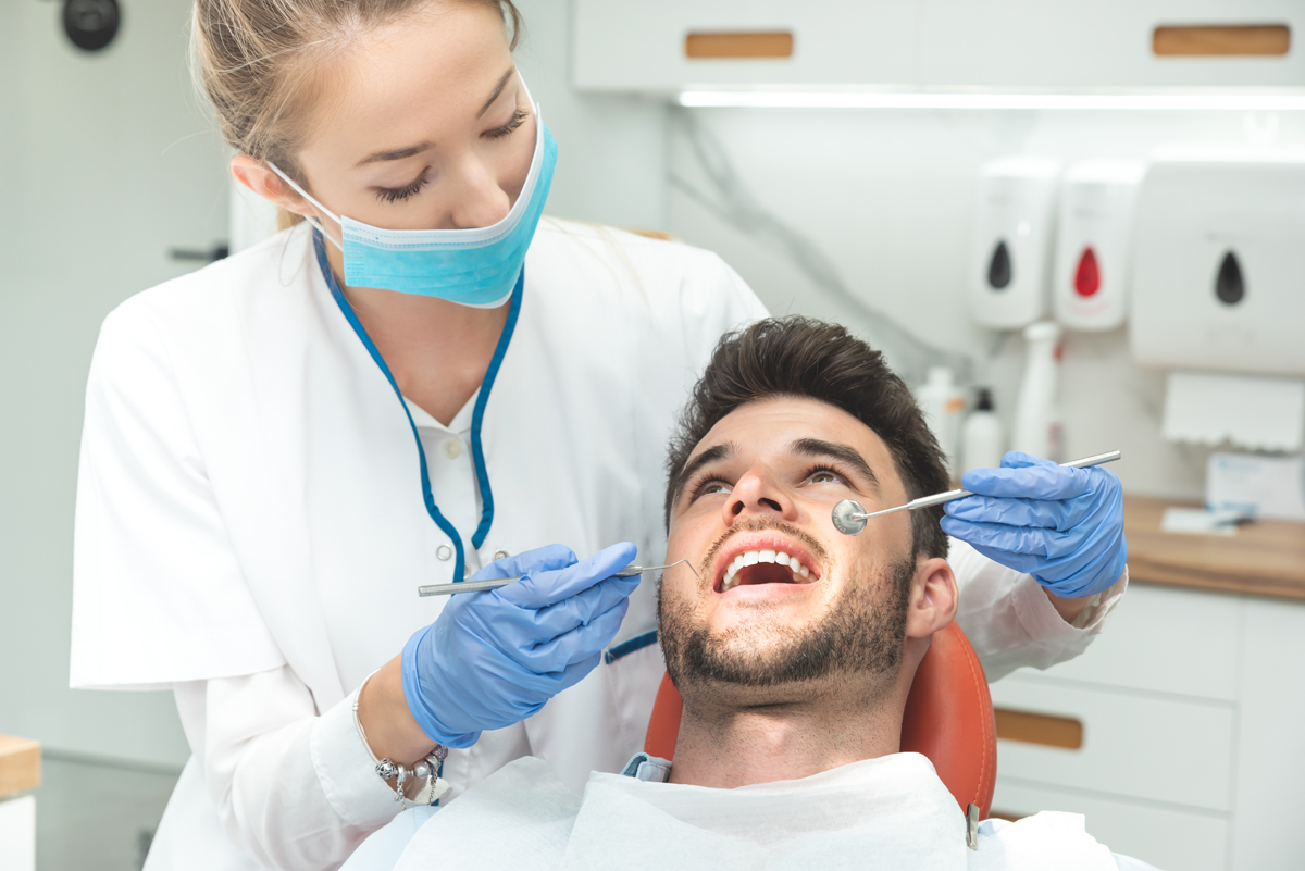 Image of a dentist with patient